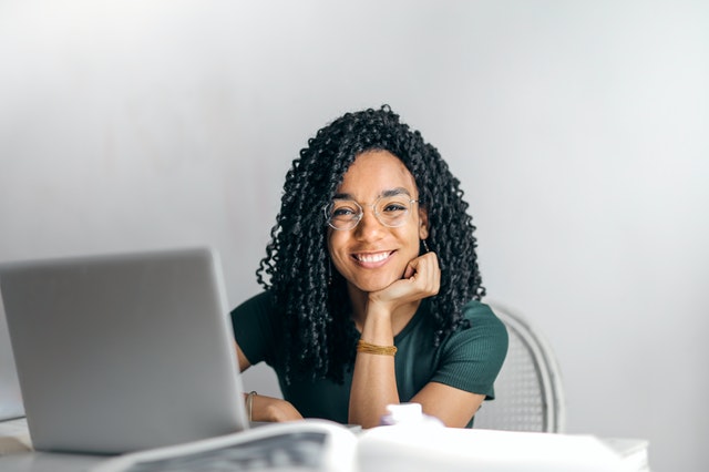 Mixed race woman on laptop